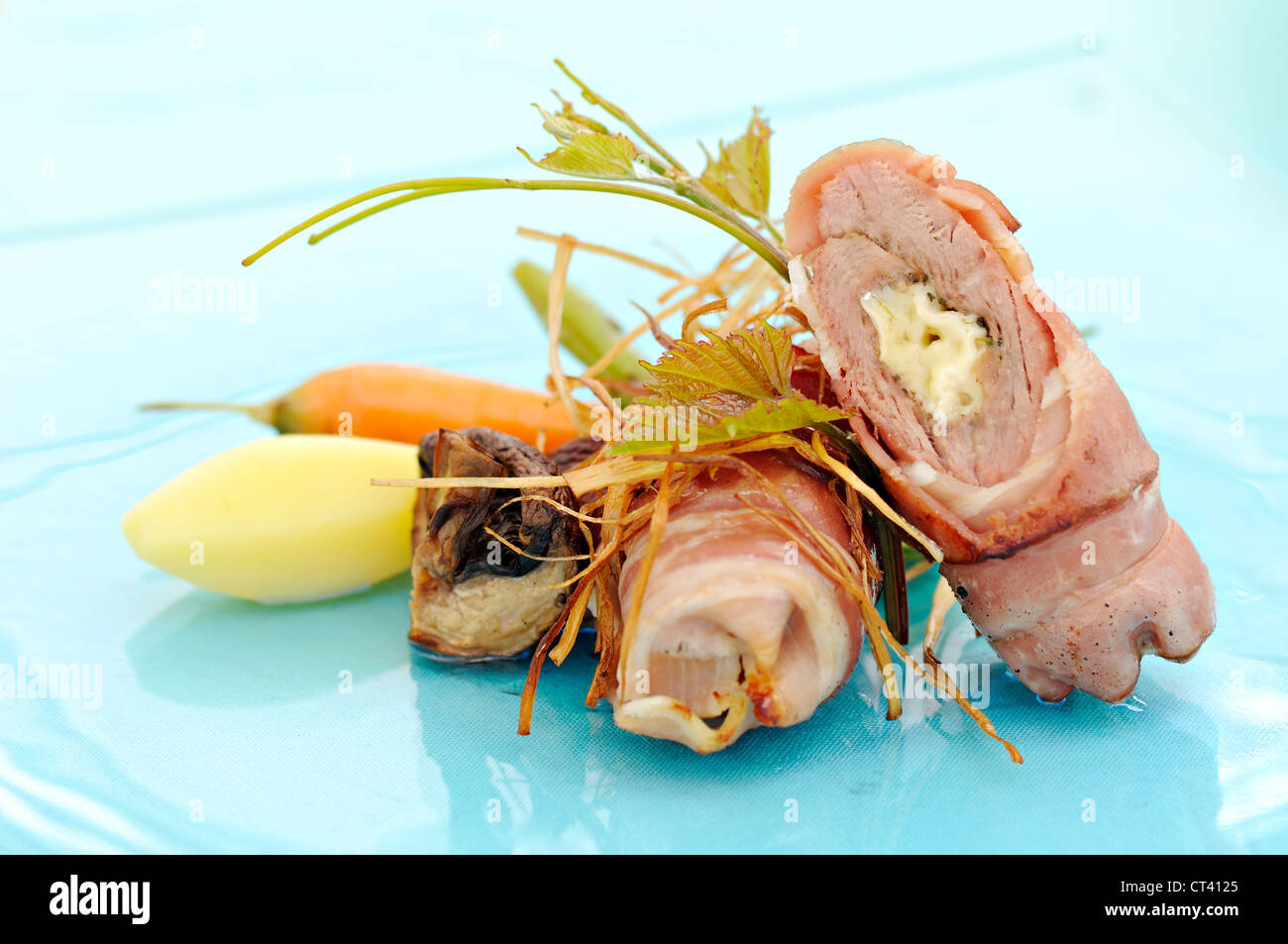 meal with rolled meat, bacon and cheese Stock Photo