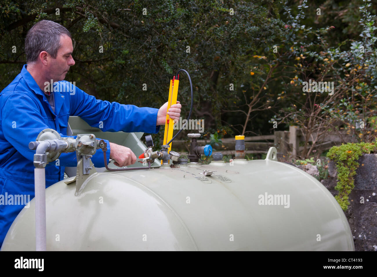 Gas engineer testing tank pressure Stock Photo Alamy