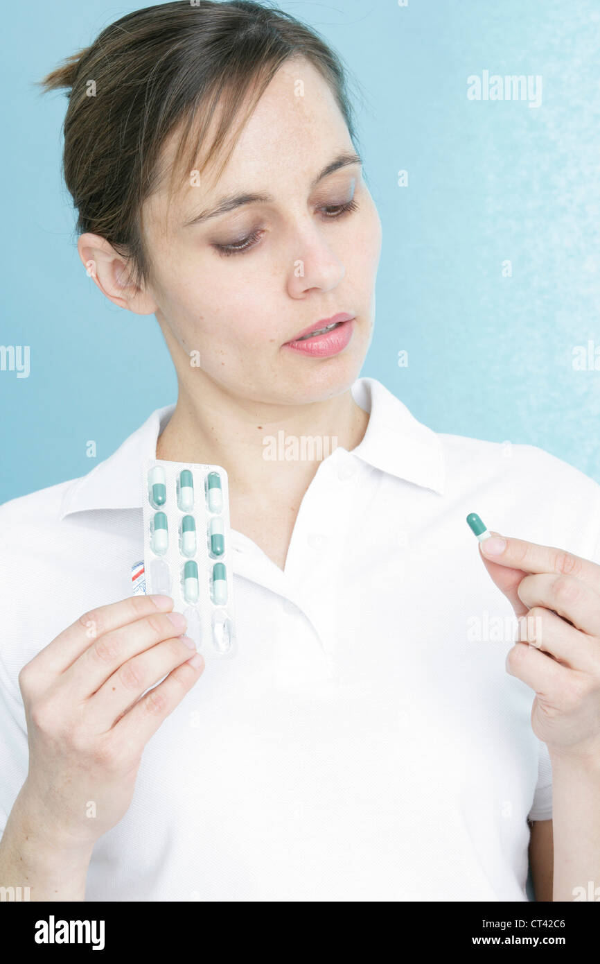 WOMAN TAKING MEDICATION Stock Photo