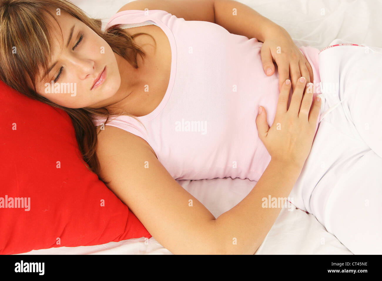 ABDOMINAL PAIN IN A WOMAN Stock Photo
