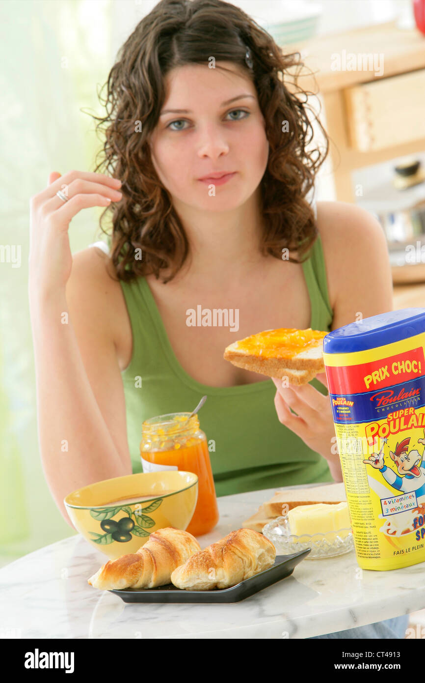 ADOLESCENT EATING BREAKFAST Stock Photo - Alamy
