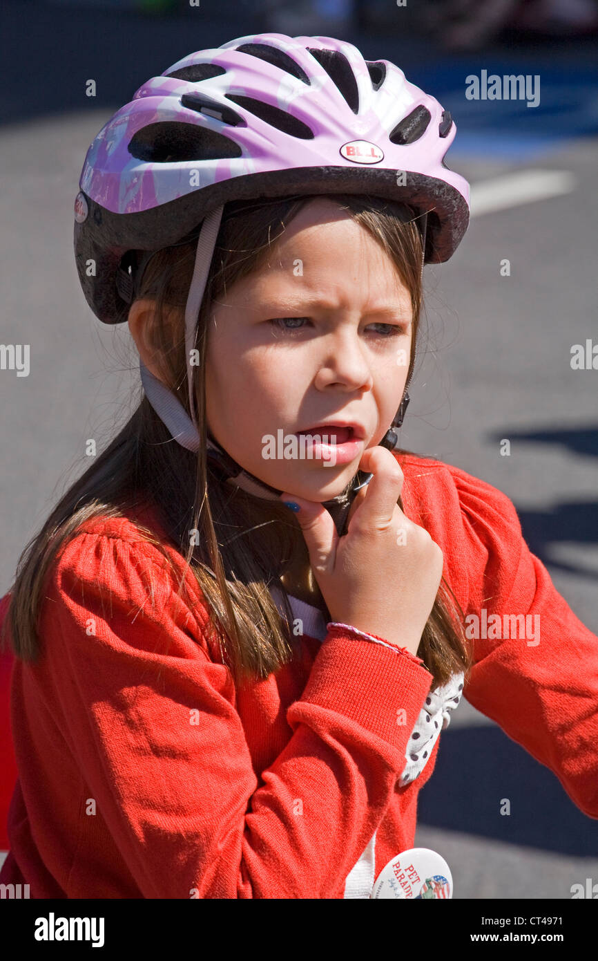A young girl wearing a bike helmet Stock Photo Alamy