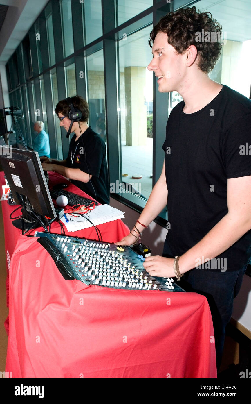 Student operating sound and lights for a show. UK Stock Photo