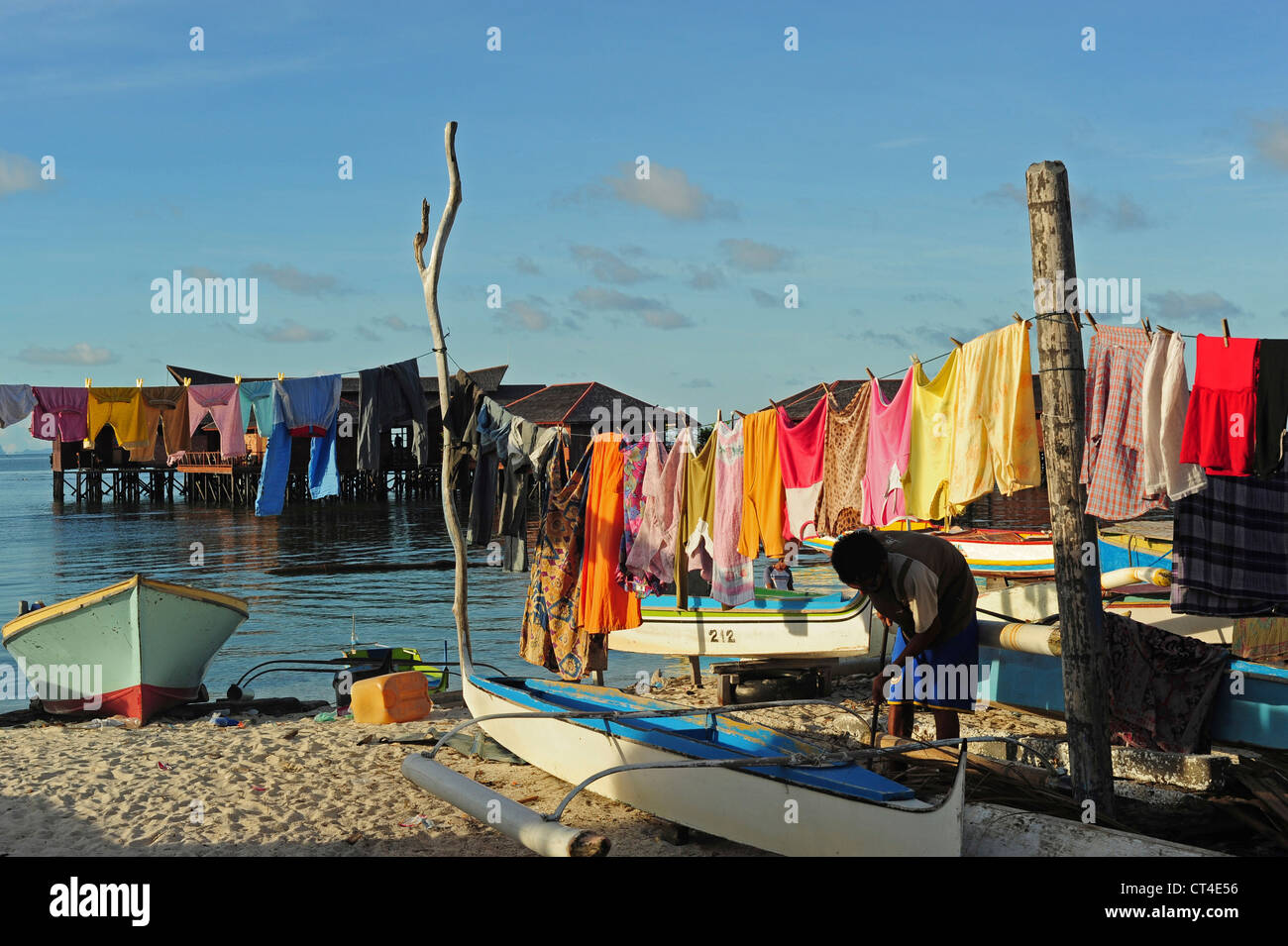 Malaysia, Borneo, Semporna, Mabul, laundry drying next to local boats Stock Photo