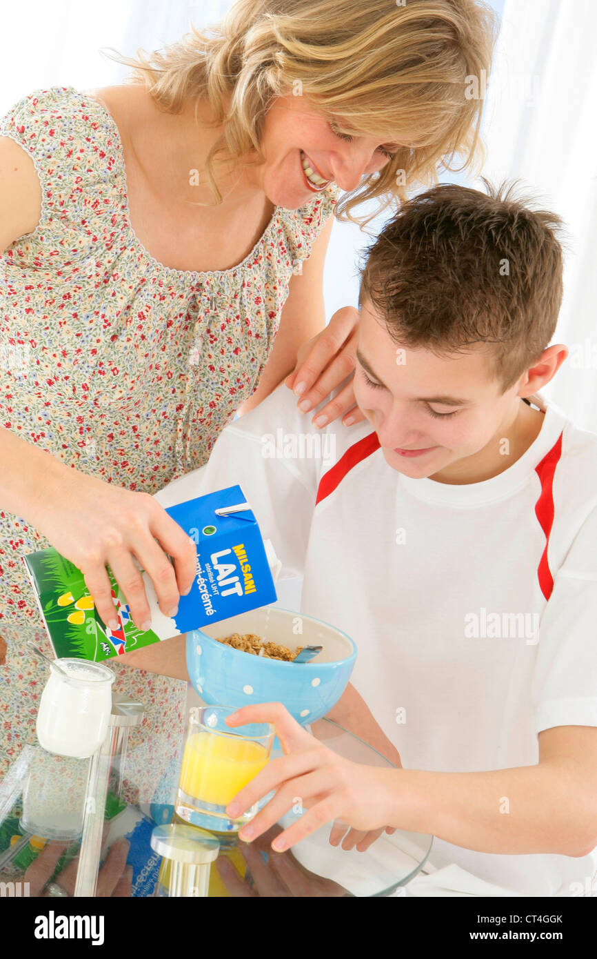 ADOLESCENT EATING BREAKFAST Stock Photo - Alamy