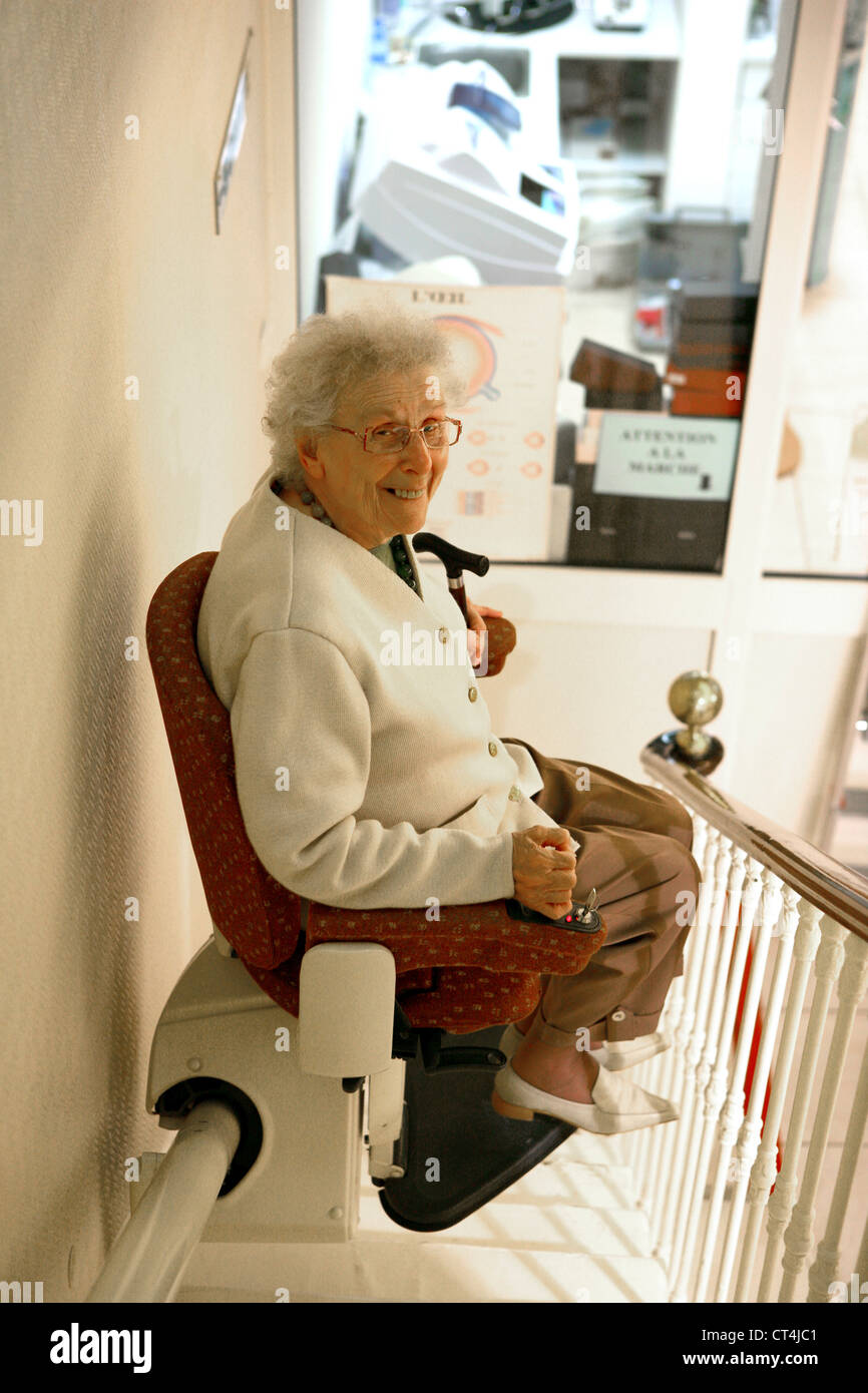 Stair lift woman hi-res stock photography and images - Alamy