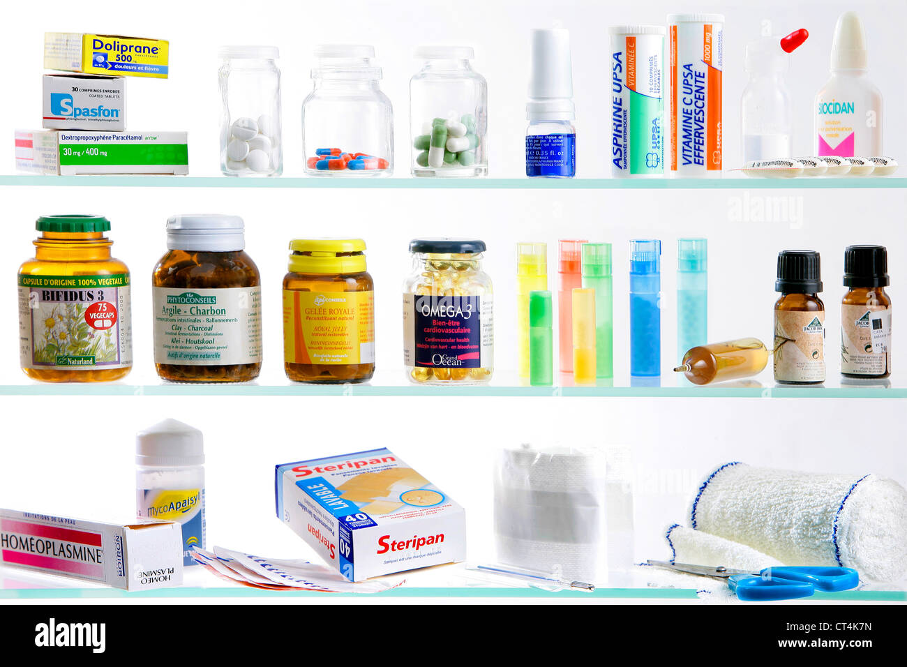 Medicine cabinet with pill bottles and syringe Stock Photo - Alamy