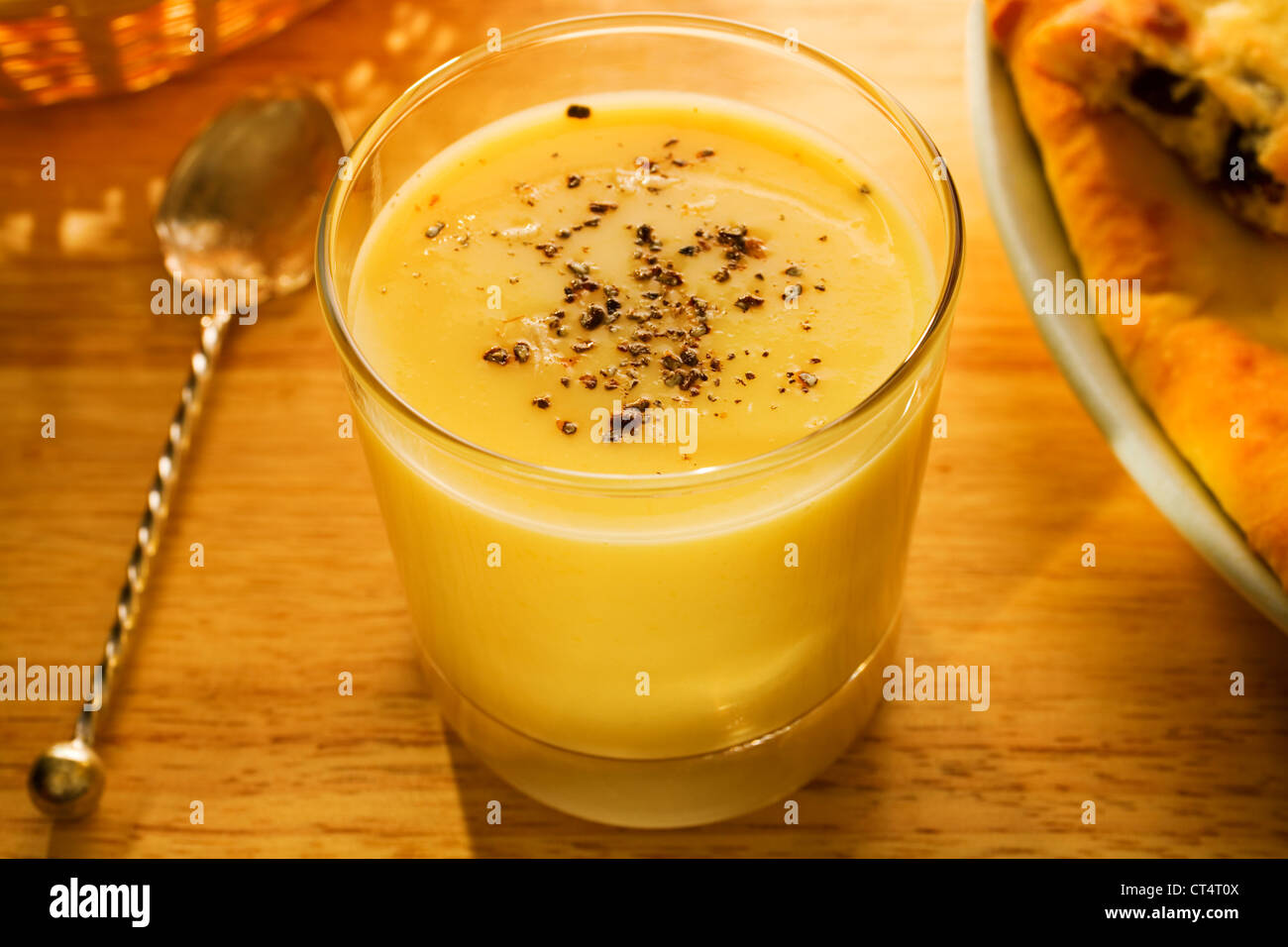 Sunny breakfast of mango buttermilk lassi with cardamom, and naan bread