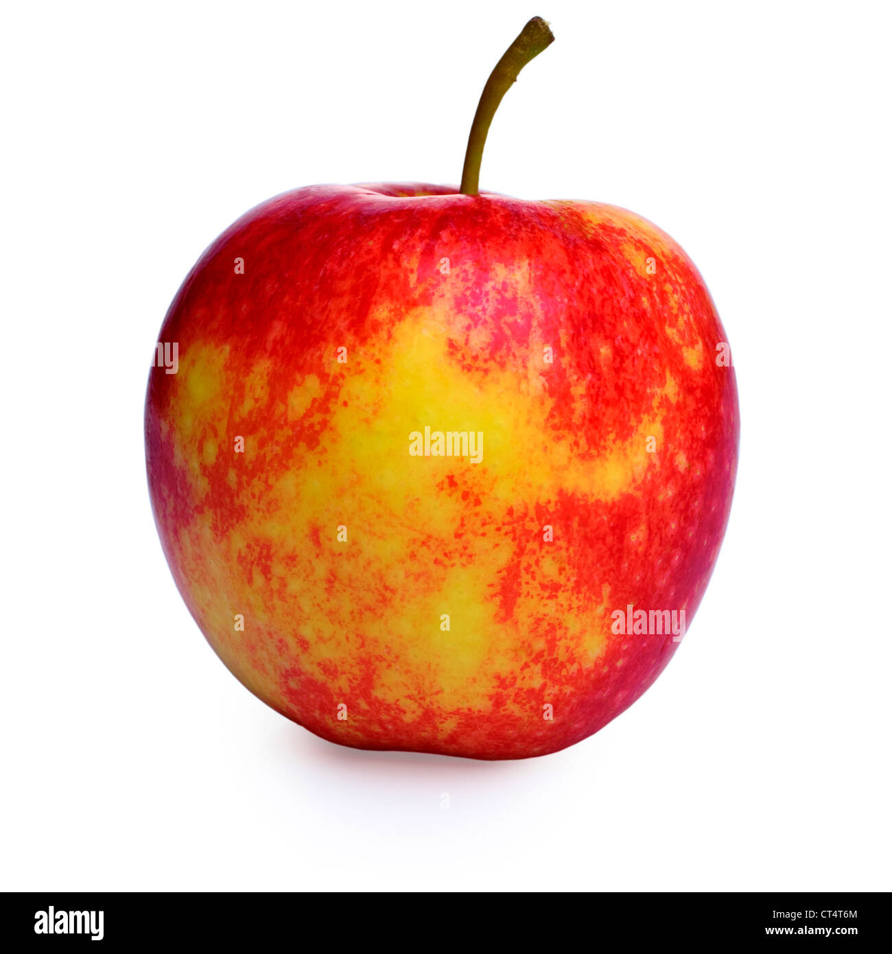 Red and yellow apple isolated on white, clipping path provided, soft shadow underneath. Stock Photo