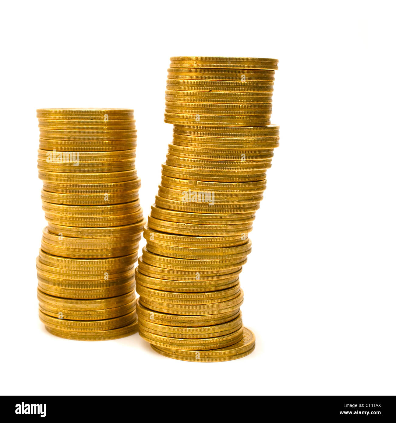 Two stacked columns of New Zealand two dollar coins on white background with small soft shadow at base. Stock Photo