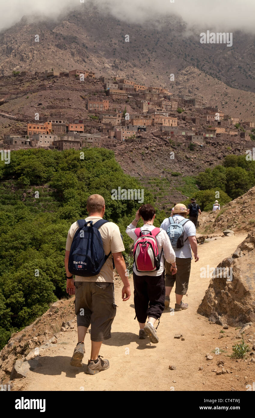 Morocco travel: tourists walking in the High Atlas mountains near Imlil, Morocco Africa, concept of Adventure Travel Stock Photo