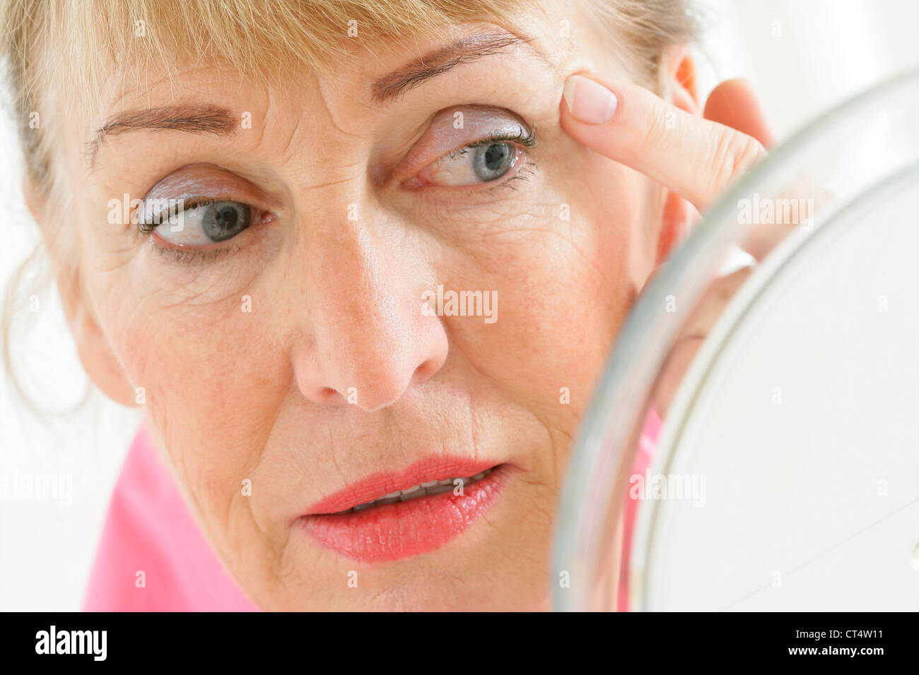 WOMAN WITH MIRROR Stock Photo