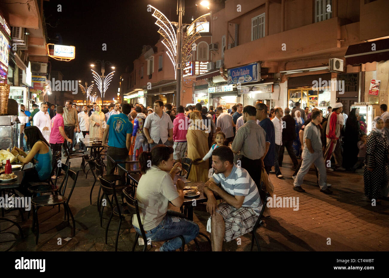 Crowded street scene at night, Marrakech, Morocco, Africa Stock Photo