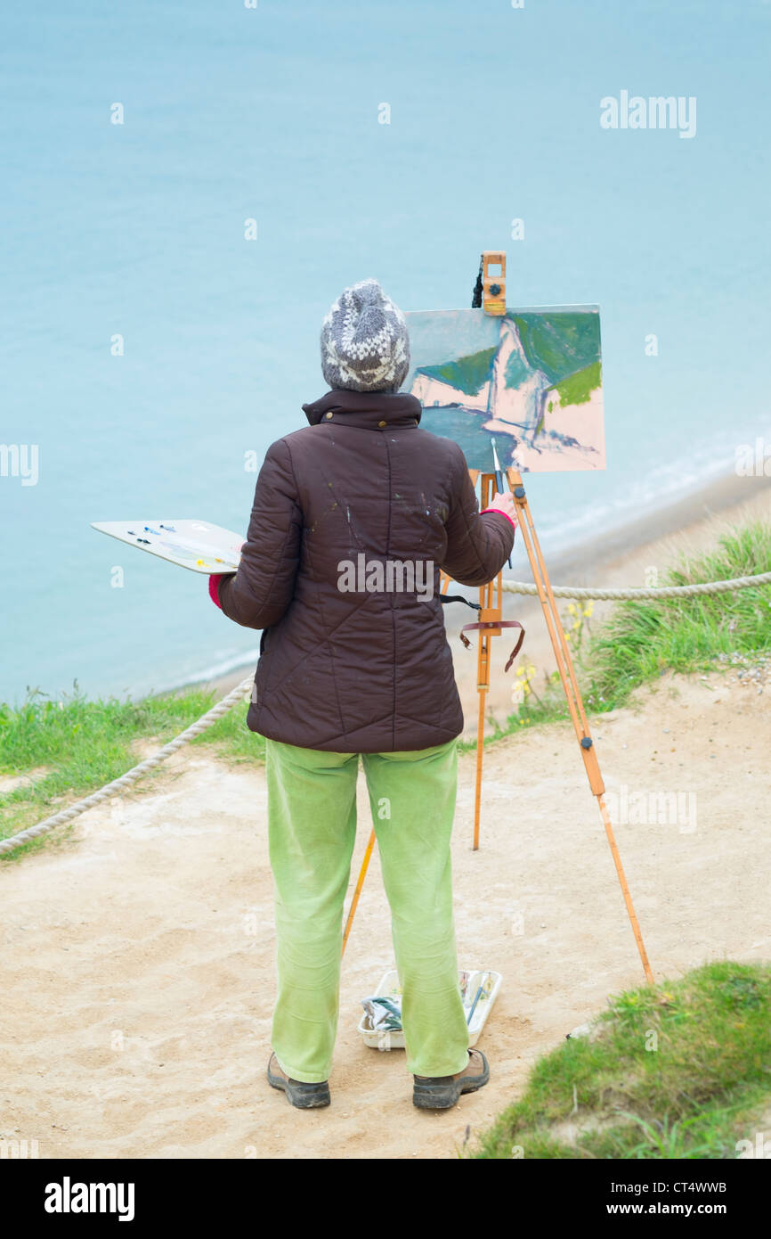 Amateur artist painting on the Dorset coast Stock Photo