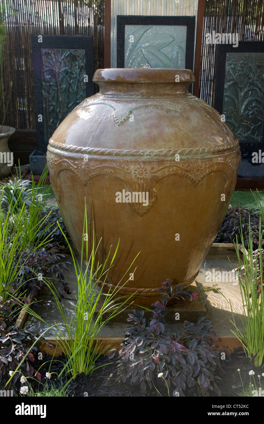 Glazed urn used as a water feature Stock Photo Alamy