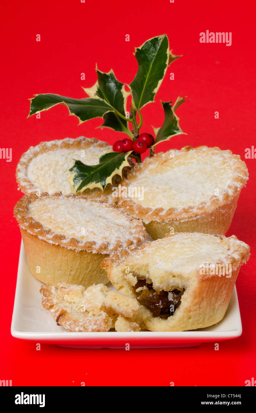 Mince pies with holly - studio shot with a red background Stock Photo ...