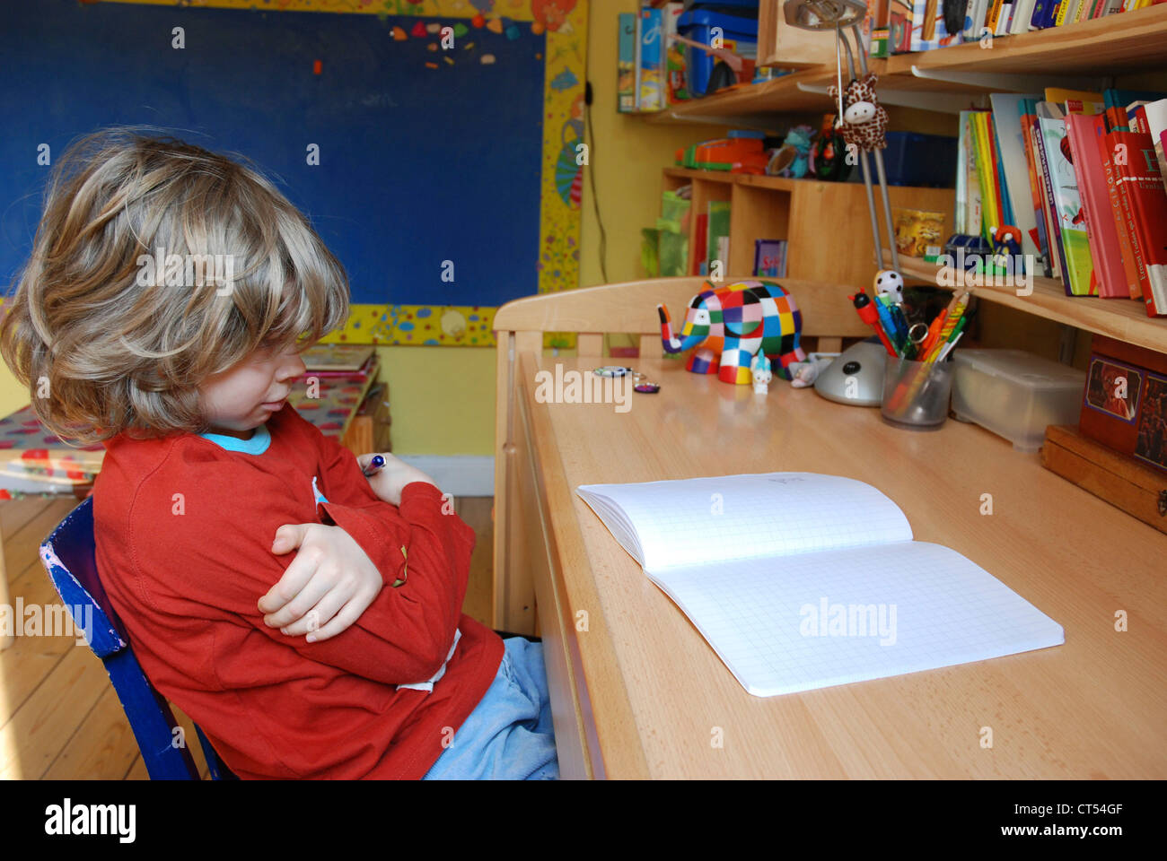 CHILD DOING HOMEWORK Stock Photo