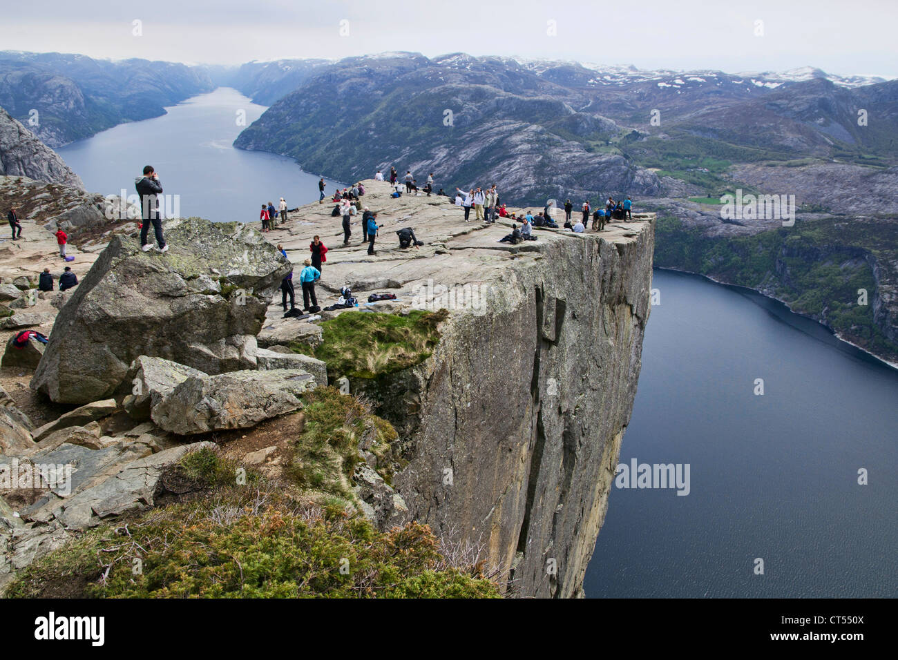 Preikestolen  is a massive cliff 604 metres (1982 feet) above Lysefjorden, opposite the Kjerag plateau, in Norway. Stock Photo