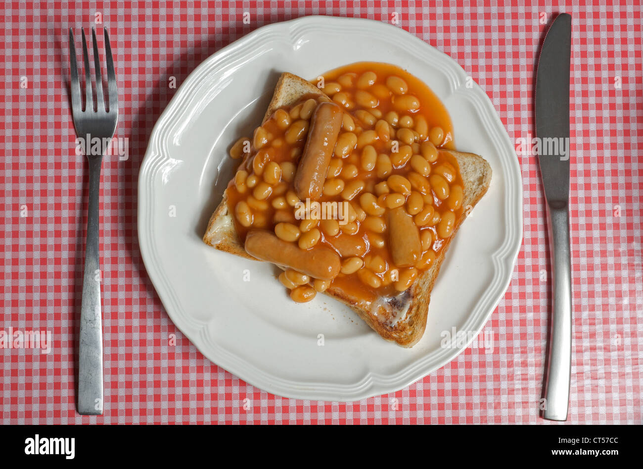 Heinz baked beans with pork sausages on toast Stock Photo