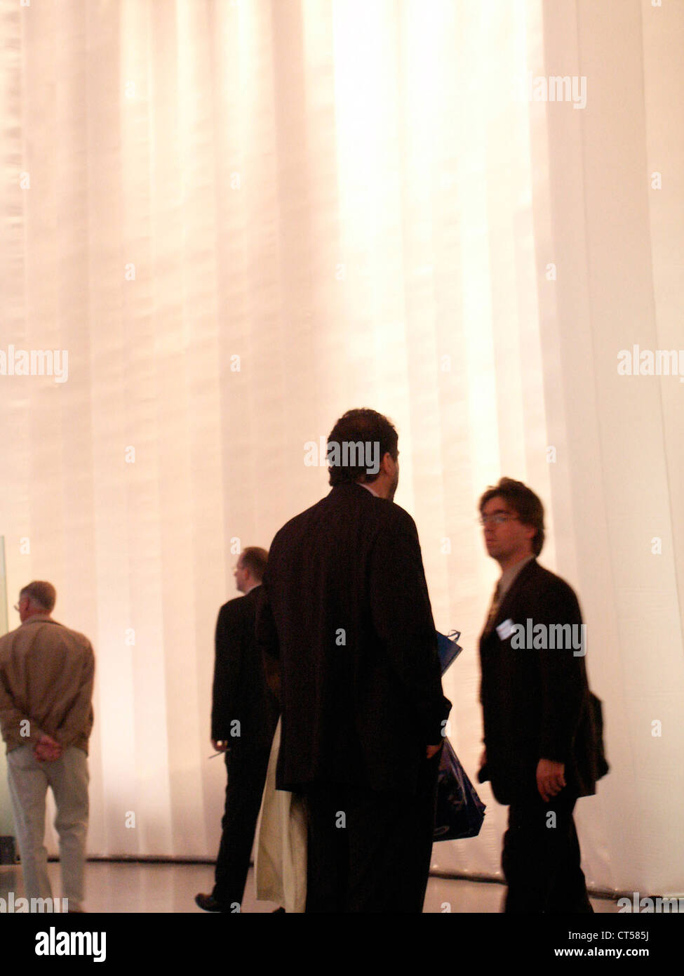 Berlin, people in an artificially lit room Stock Photo