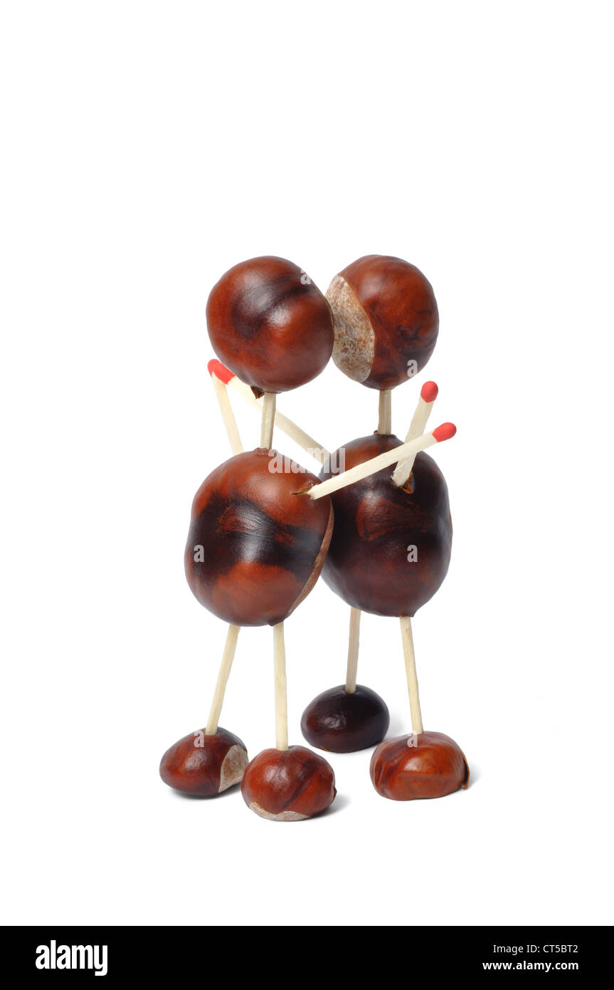 Toys made from chestnuts and matches on white background Stock Photo