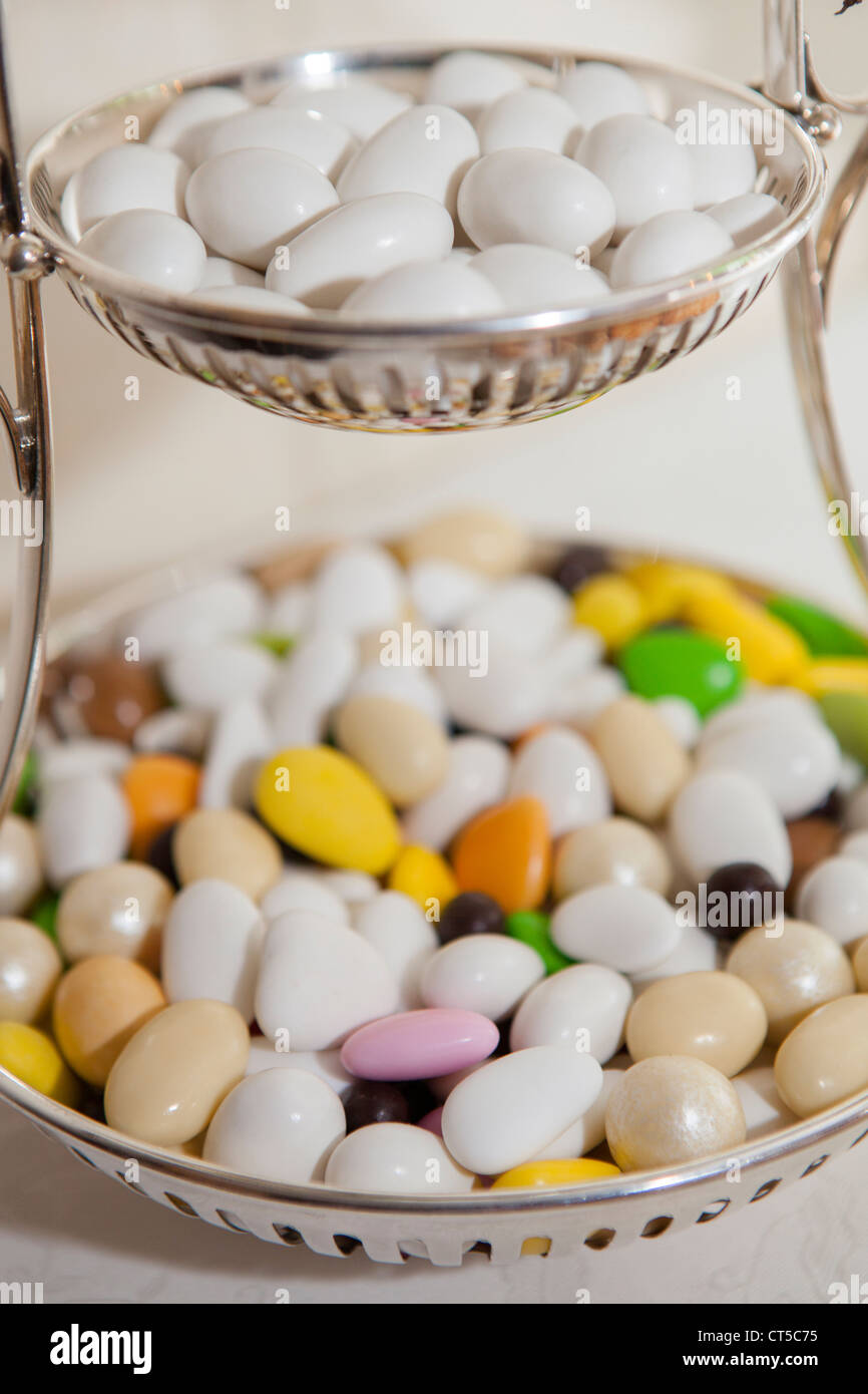 Silver bowl of sweets and confetti Stock Photo Alamy