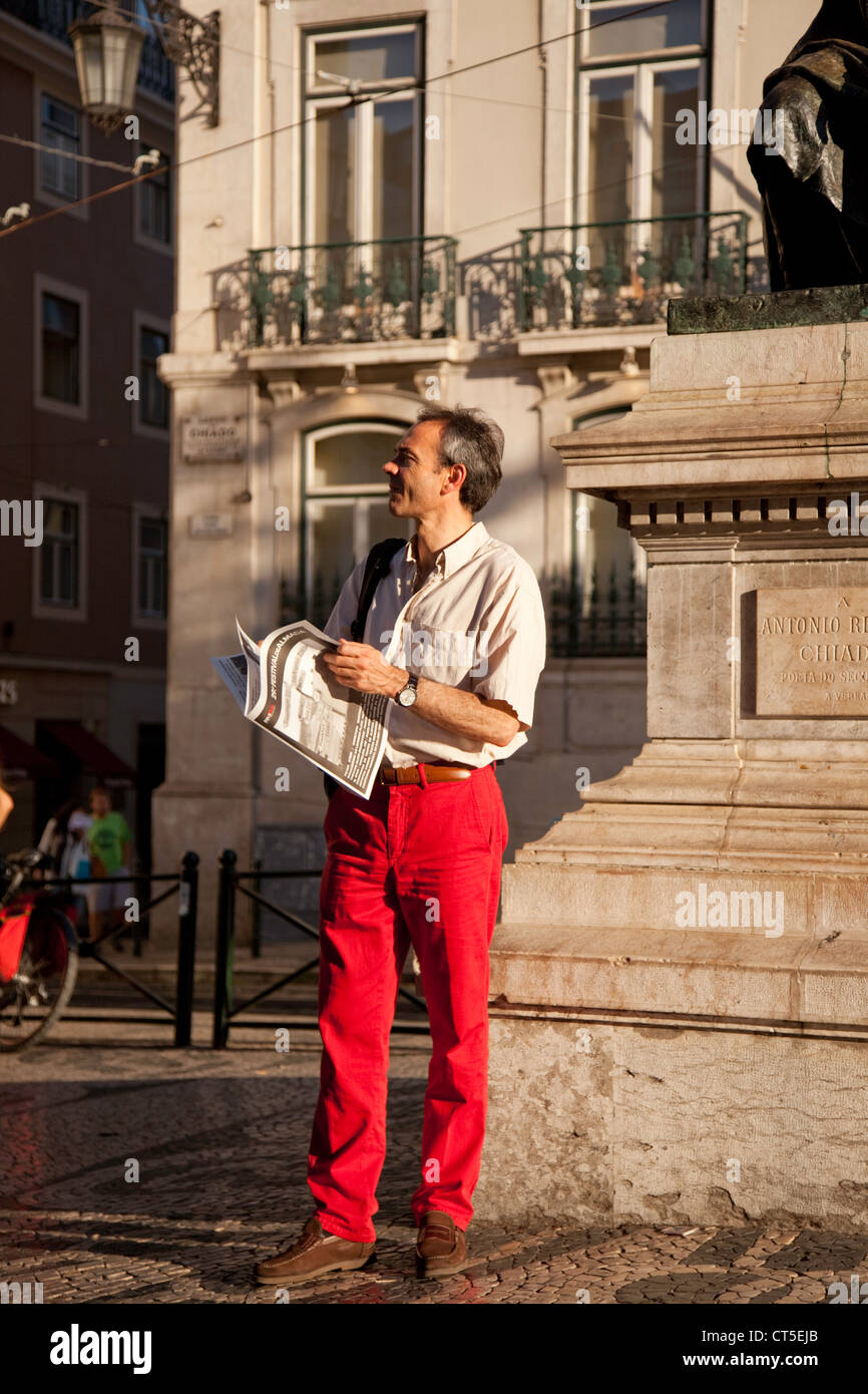 Man with newspaper in Lisbon Stock Photo Alamy