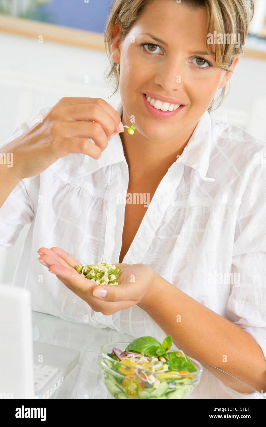WOMAN EATING RAW VEGETABLES Stock Photo Alamy