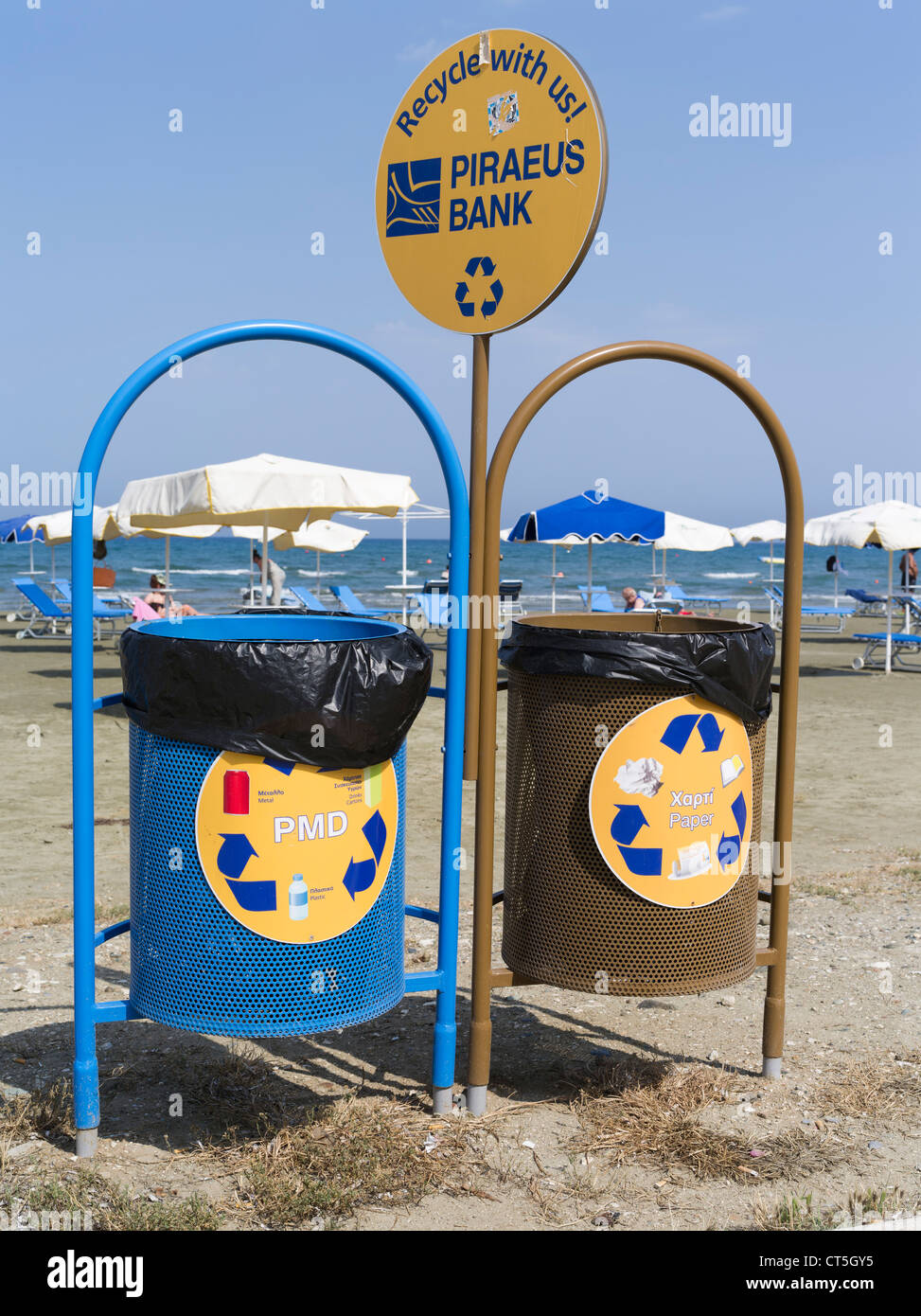 dh  LARNACA CYPRUS Piraeus Bank advert recycle bins larnaka beach on beaches trash bin Greece cypriot collection recycling Stock Photo