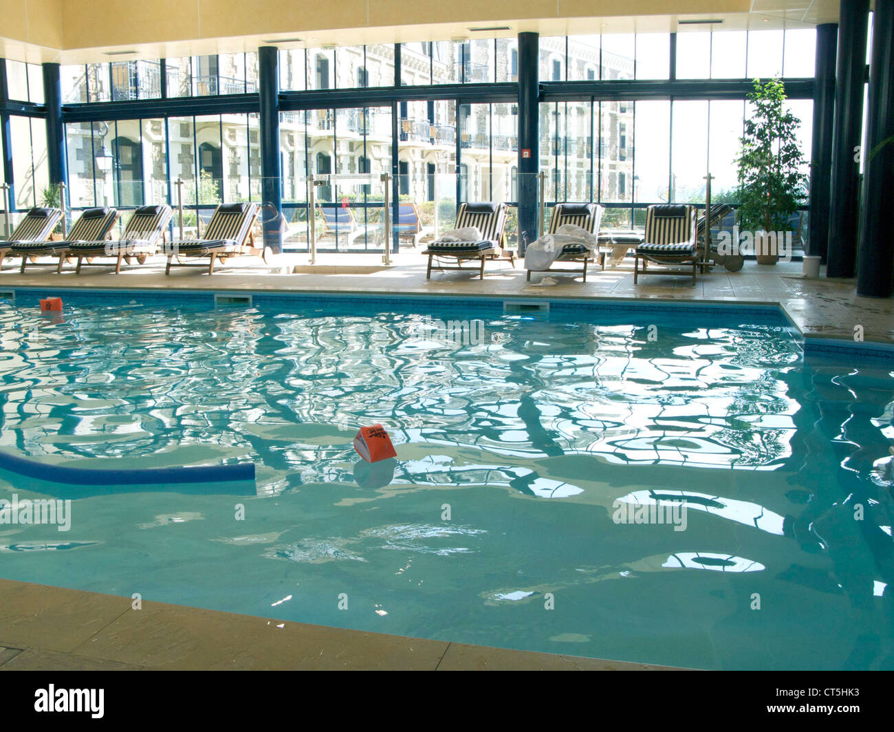 Deck chairs swimming pool indoor hi-res stock photography and images ...