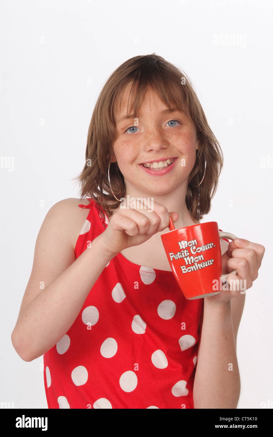 ADOLESCENT WITH HOT DRINK Stock Photo