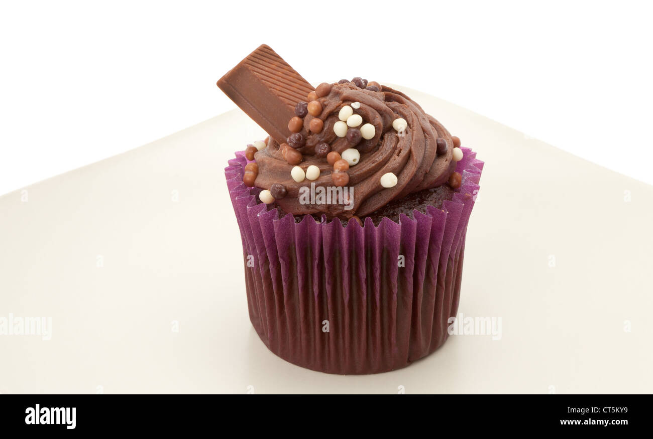 Chocolate Cup Cake With Buttercream Icing And A Chocolate Bar On A