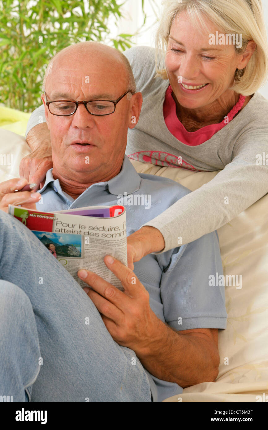 ELDERLY PERSON READING Stock Photo