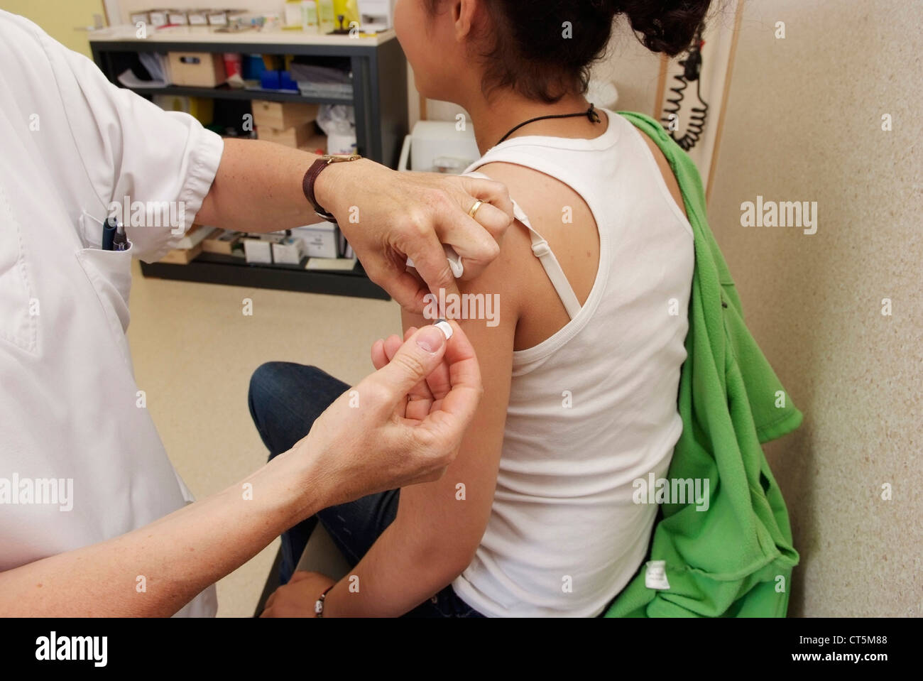 VACCINATING AN ADOLESCENT Stock Photo