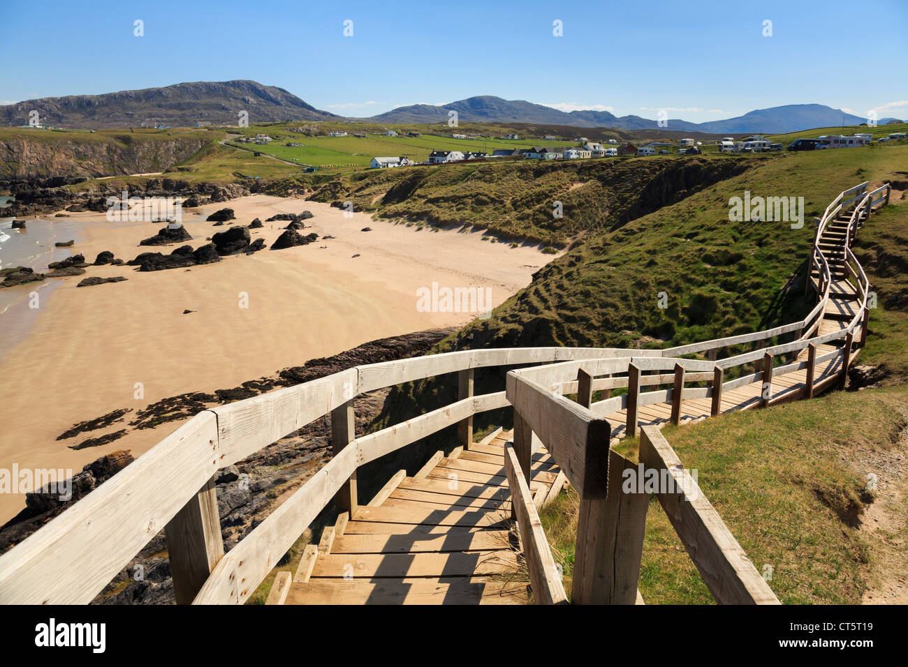 Wooden steps to viewpoint overlooking sandy beach and blue sea on scenic Scottish North Coast 500 route at Sango Bay Sutherland Scotland UK Stock Photo