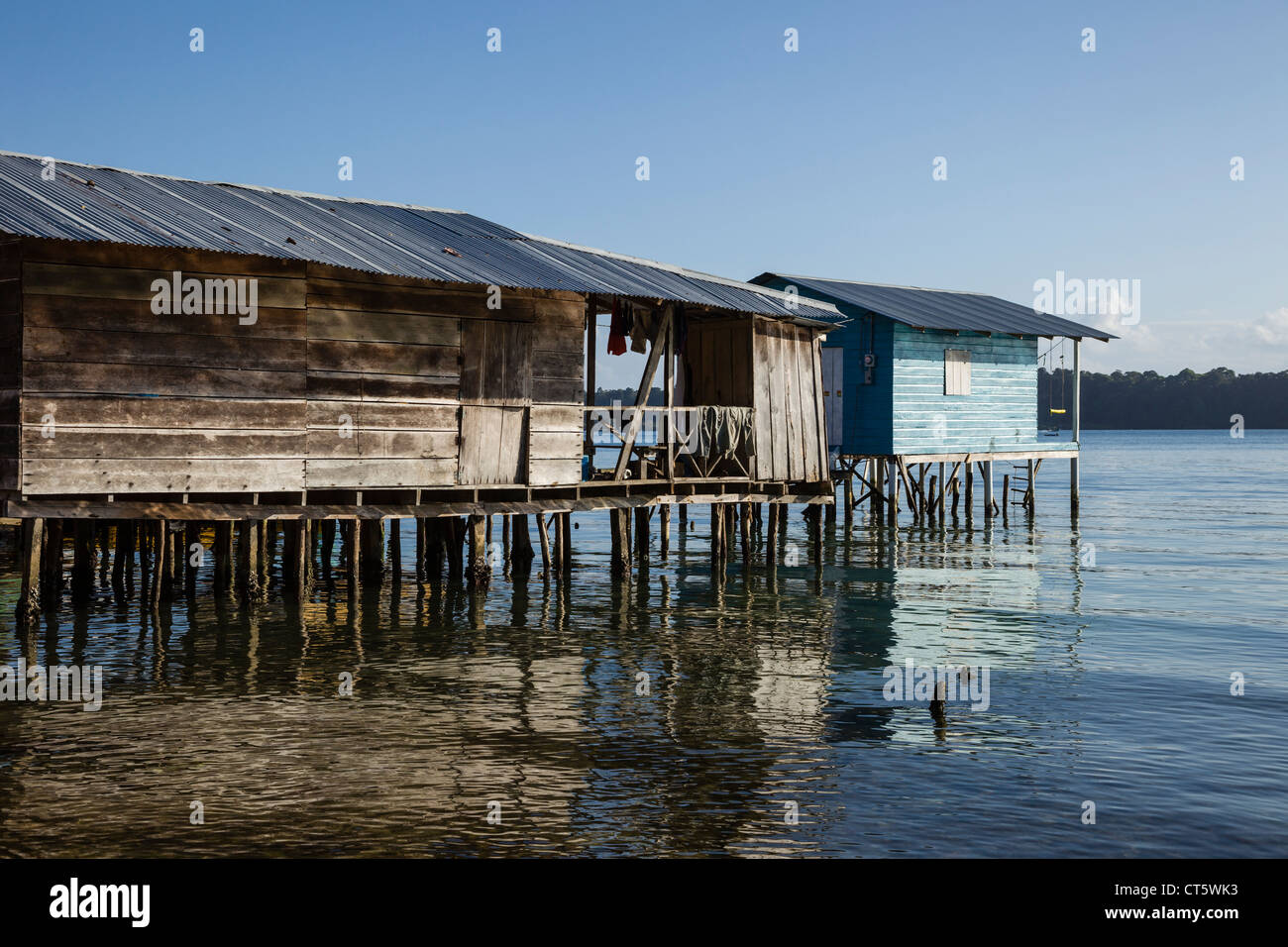 Elevated wooden houses sit over the sea in the Afro-Caribbean town of Old Bank on Isla Bastimentos, Bocas del Toro, Panama. Stock Photo