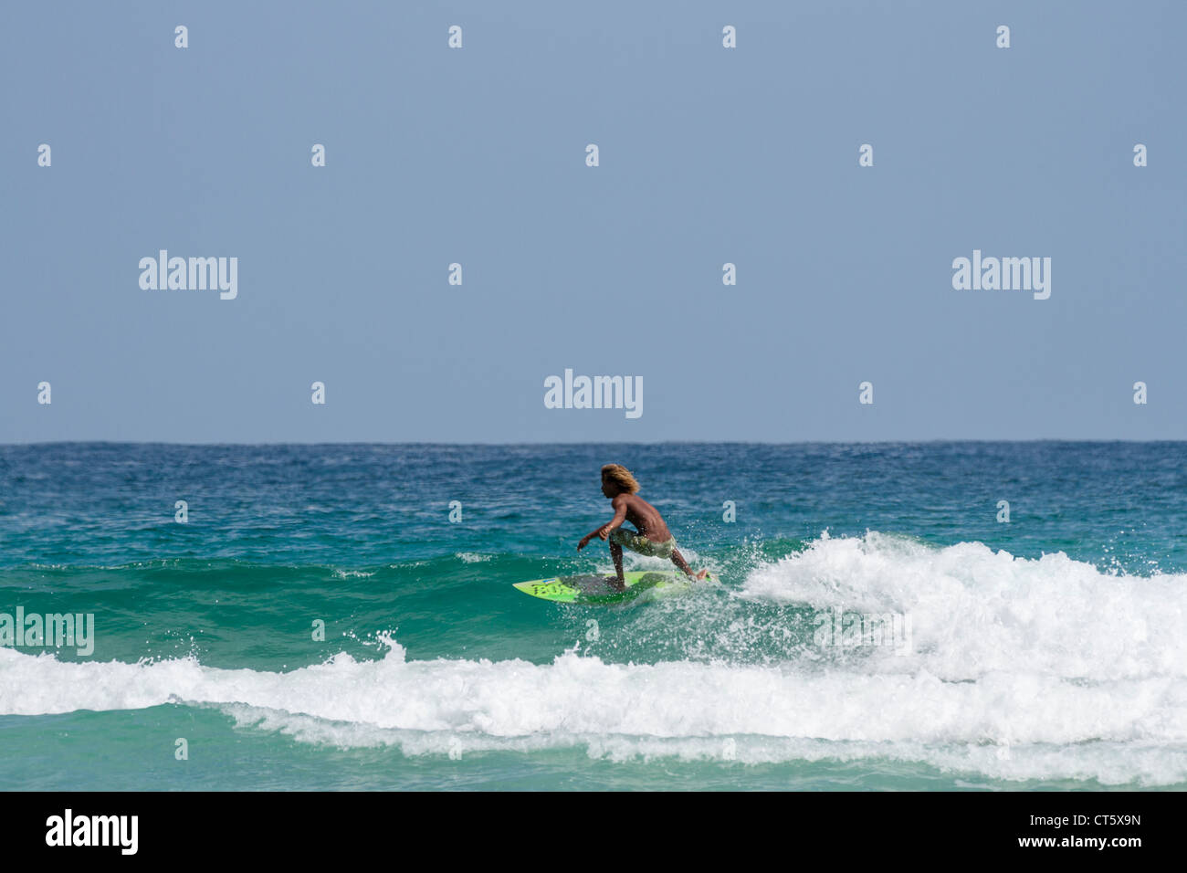 Surfing the beach break at Wizard Beach (First Beach) on Isla
