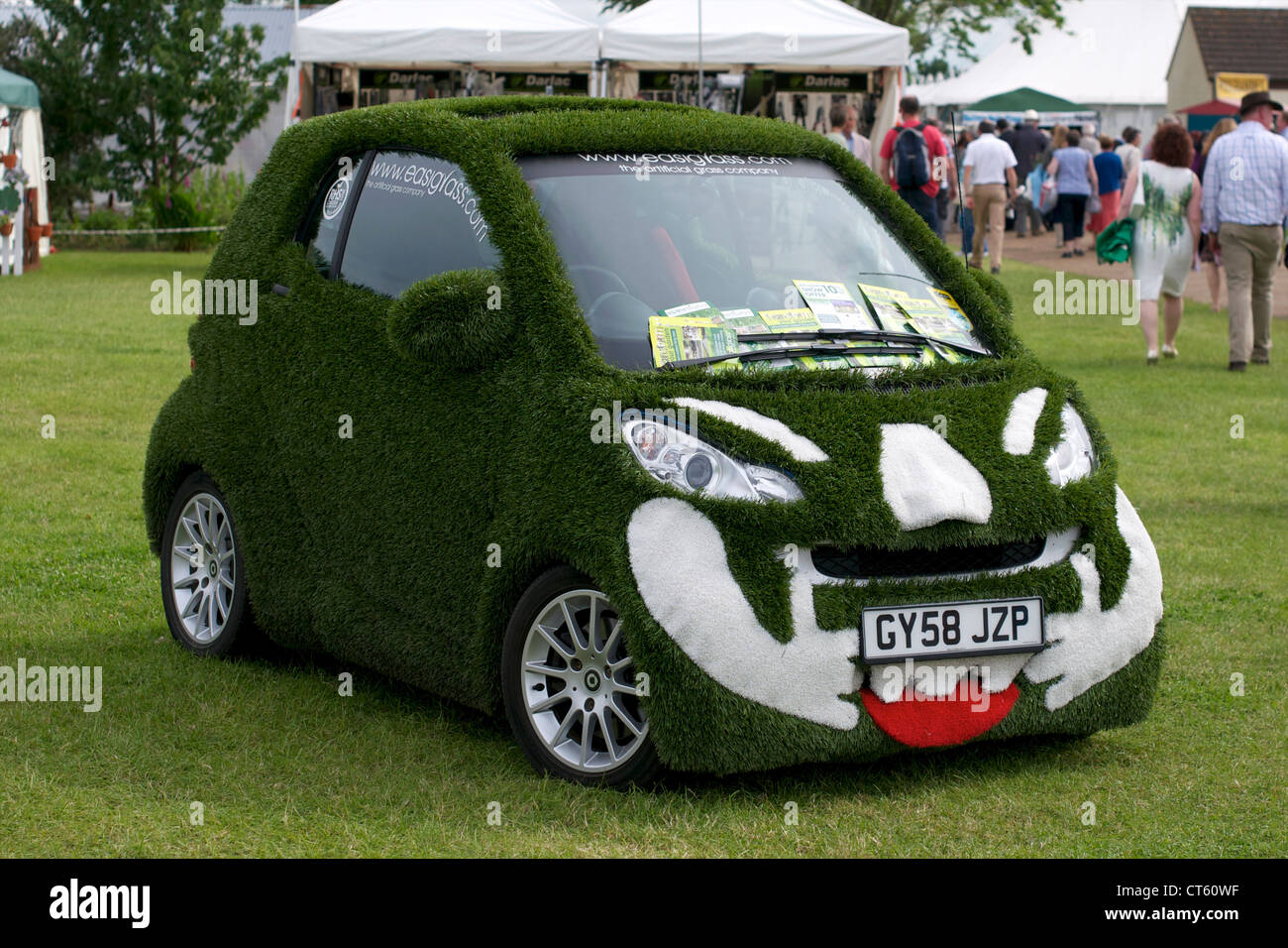 A Smart Car covered in fake grass at the annual Royal Norfolk Show held
