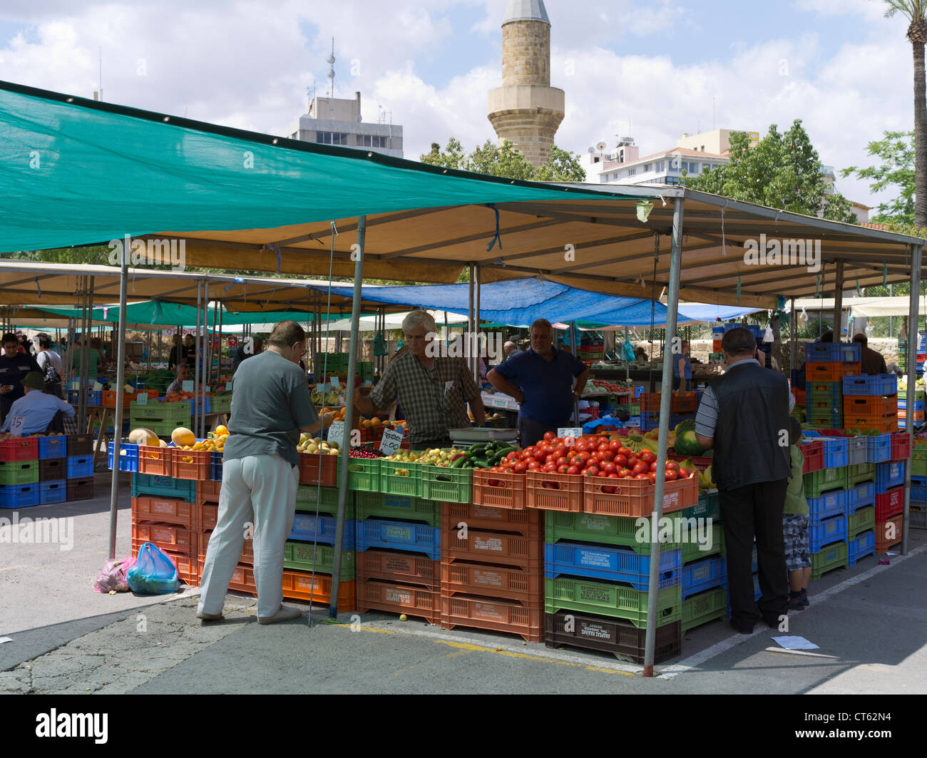 dh Lefkosia Market South NICOSIA CYPRUS Stall holder and customers at open air Saturday fruit and vegetable market Stock Photo