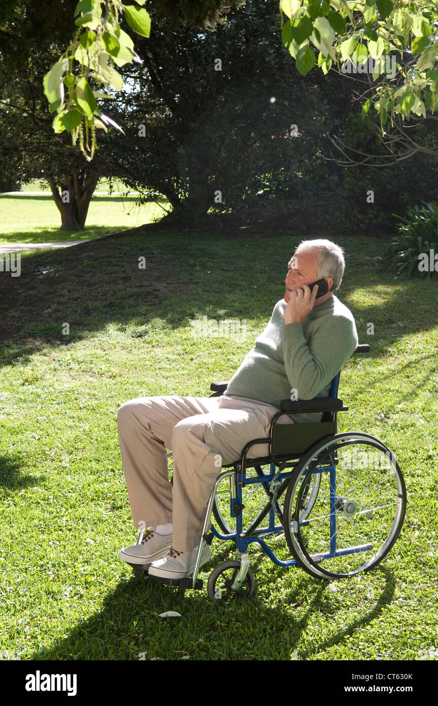 ELDERLY PERSON IN WHEELCHAIR Stock Photo