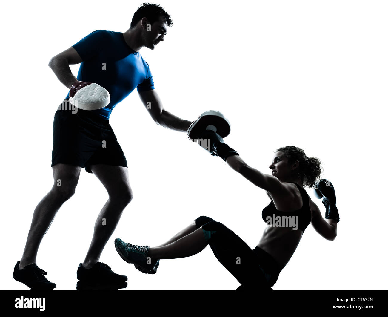 one caucasian couple man woman personal trainer coach man woman boxing training silhouette studio isolated on white background Stock Photo