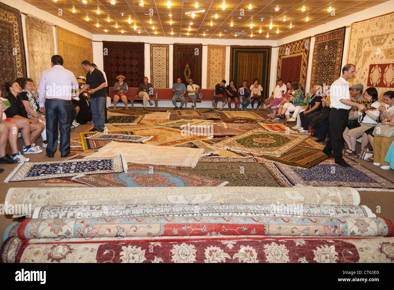 Tourists Visiting The Galata Carpet Factory Selcuk Turkey Stock