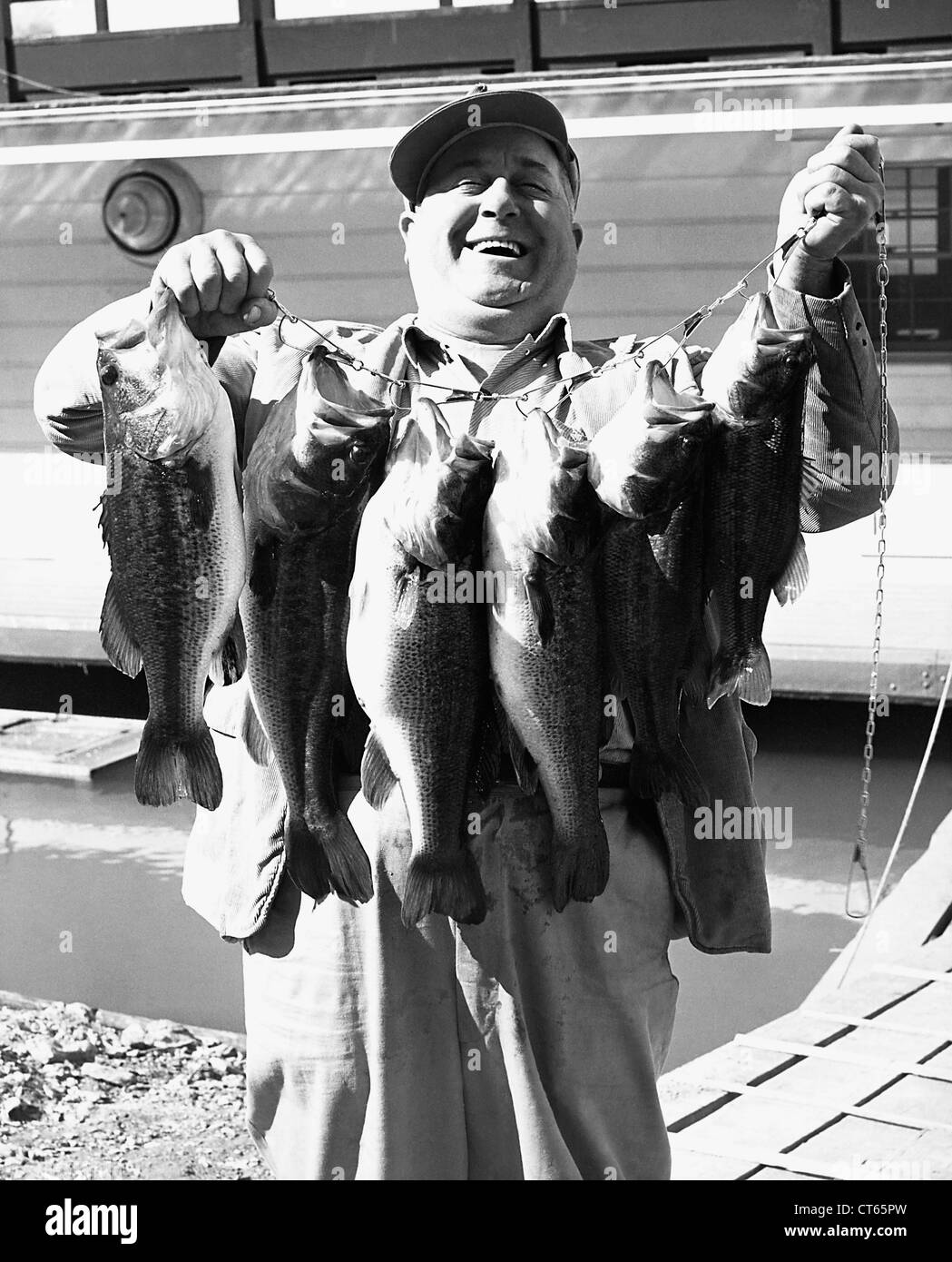 Excited man with fish he caught Stock Photo