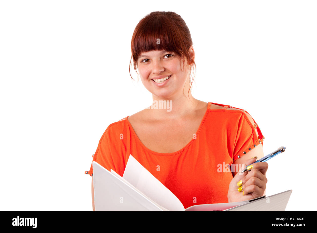 College student takes notes for her homework Stock Photo