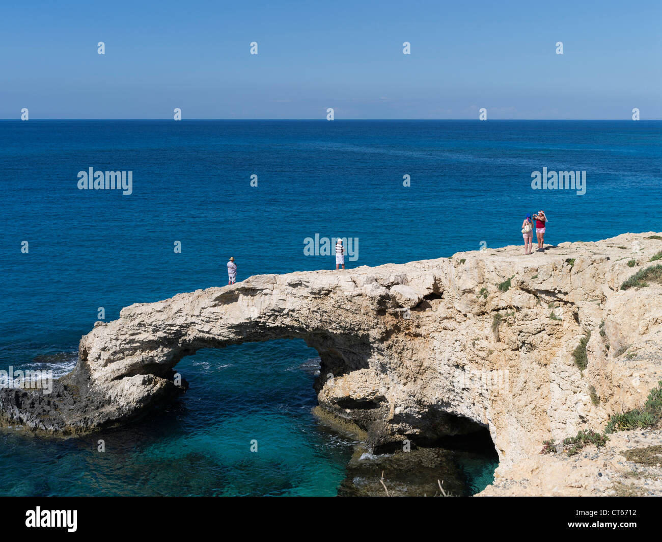 dh Sea arch AYIA NAPA SOUTH CYPRUS Russian tourist couples clear blue sea island holiday tourists cliff russians Stock Photo