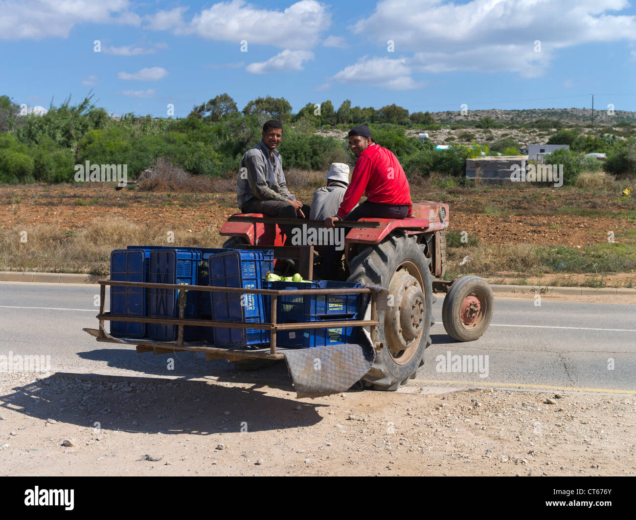 dh Cypriot farmworkers Greece FARMING SOUTH CYPRUS Fields on tractor farm workers tractors island worker people agricultural Stock Photo
