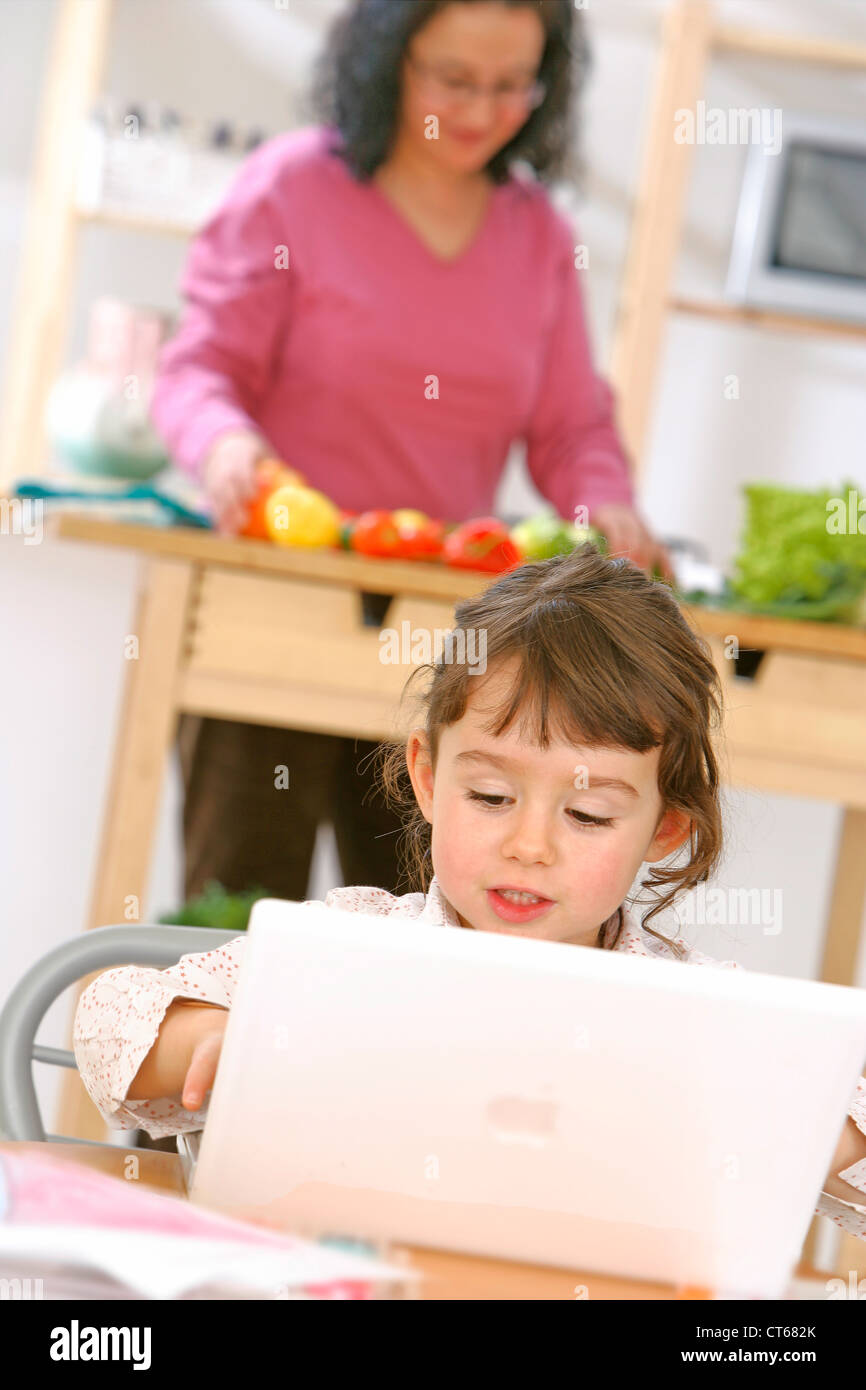 Child with portable computers hi-res stock photography and images - Alamy
