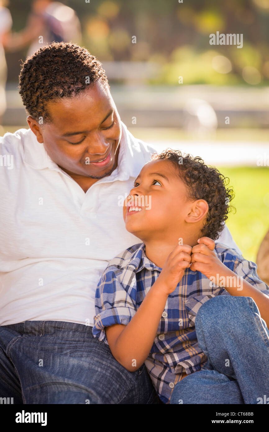 Happy African American Father and Mixed Race Son Playing in the Park ...