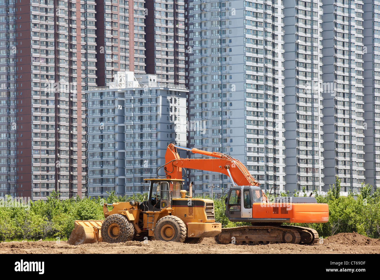 Urban residential community and construction vehicle. Stock Photo