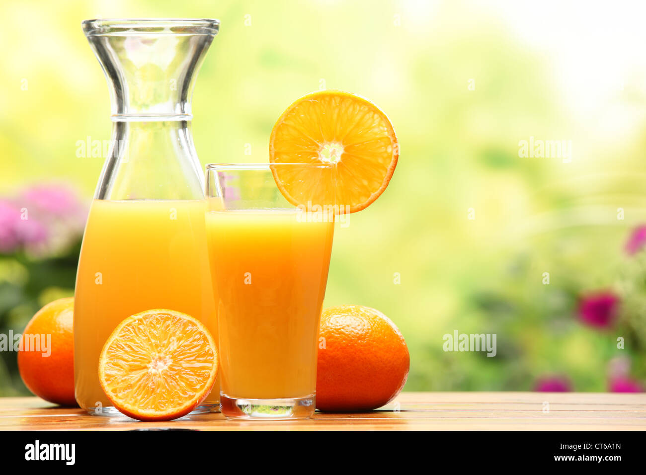 Two glasses of orange juice and fruits Stock Photo